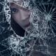 Woman face behind broken window glass with expressive look... (thumbnail)