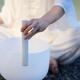 Woman playing a quartz crystal singing bowl for healing sound therapy... (thumbnail)