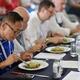 Chefs competition judges evaluating a gourmet meal at BC Seafood Festi... (thumbnail)