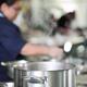Woman Chef behind a steaming pot in a kitchen... (thumbnail)