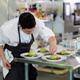 Executive Chef Quang Dang garnishing a gourmet competition meal at BC... (thumbnail)