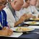 Chef competition judge making notes on a gourmet competition meal at B... (thumbnail)
