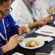 Chefs competition judge making pictures of a gourmet meal at BC Seafoo... (thumbnail)