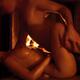 Couple Making Love at a Fireplace... (thumbnail)