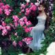 Romantic sensual portrait of woman in a long elegant dress in a rose g... (thumbnail)