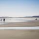 People at the Pacific Rim National Park walking along the sandy beach... (thumbnail)