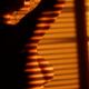 Art nude portrait of a woman standing in light coming through window b... (thumbnail)