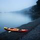 Red kayak on a sea shore in yearly morning mist... (thumbnail)