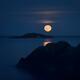 Rising big red Blood Moon Full Harvest Moon above Pacific ocean... (thumbnail)