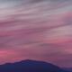 Surreal red twilight sky panorama above mountains on the Pacific ocean... (thumbnail)