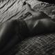 Candid artistic nude portrait of a beautiful naked woman lying undress... (thumbnail)
