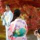 Japanese girls in colorful yukatas taking pictures in Kyoto autumn sce... (thumbnail)