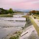 Couple crossing Kamo River by walking on stepping stones Kyoto city sc... (thumbnail)