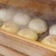 Nikuman Japanese steamed pork buns in a steamer of street shop... (thumbnail)