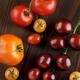 Organic heirloom tomatoes of different sizes and colors artistic still... (thumbnail)