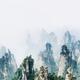 Mountain spires rising from thick milky fog at Zhangjiajie National Pa... (thumbnail)