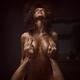 Dynamic sensual art nude portrait of a couple making love woman with w... (thumbnail)