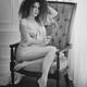 Sensual romantic black and white portrait of a girl sitting in a chair... (thumbnail)