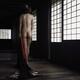 Beautiful asian woman in a Japanese house with her nude back lit by th... (thumbnail)