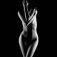 Nude black and white figure of a naked woman covering her face with a... (thumbnail)