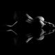 Nude figure of a woman back lying naked on reflective surface... (thumbnail)