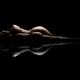 Abstract art nude figure of a lying woman back silhouette with a refle... (thumbnail)
