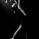 Woman dancer naked in a black tutu arching backwards... (thumbnail)