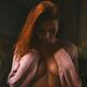 Dramatic expressive portrait of a woman covering bared chest with her... (thumbnail)