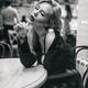 Beautiful sexy provocatively dressed woman in stockings sitting at a r... (thumbnail)
