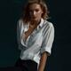 Portrait of a woman with an expressive look in an unbuttoned white shi... (thumbnail)