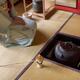 Japanese tea room with Kama kettle and a woman tea ceremony master sit... (thumbnail)