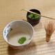 Japanese ceremonial matcha tea set of a bowl with green tea a whisk an... (thumbnail)