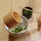 Japanese tea ceremony still life bamboo ladle pouring water into a mat... (thumbnail)