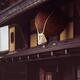 Sugidama aged cedar orb with Shimenawa rope hanging above entrance of... (thumbnail)