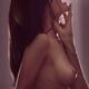 Man's hand caressing neck and face of a nude woman Couple making... (thumbnail)