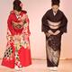 Japanese women in elegant kimonos bowing at a fashion show... (thumbnail)