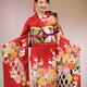 Japanese woman in a beautiful red kimono with a colorful pattern at a... (thumbnail)
