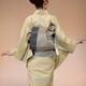 Back of a Japanese woman showing an obi belt of an elegant light green... (thumbnail)
