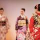 WOman wearing a kimono with obi belt in red and gold at Japanese fashi... (thumbnail)