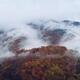 Fog covered hills in atmospheric aerial autumn nature scenery... (thumbnail)