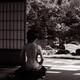 Japanese woman sitting in a house with Zen garden view with her undone... (thumbnail)
