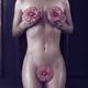 Beautiful nude woman body with pink camellia flowers artistic concept... (thumbnail)
