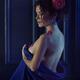 Woman with pink camellia flower in her hair covering her naked body wi... (thumbnail)