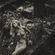 Naked woman in a forest with a tranquil thoughtful expression Fine art... (thumbnail)