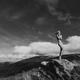Nude woman standing gracefully on rocks in mountain landscape scenery... (thumbnail)