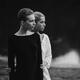Black and white portrait of two young women standing together... (thumbnail)