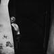 Black and white artistic half-nude portrait of a young woman leaning a... (thumbnail)