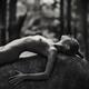 Romantic fine art black and white nude photograph of a young woman lyi... (thumbnail)