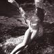Beautiful nude woman lying naked on a trunk of a tree in the nature Se... (thumbnail)