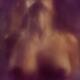 Abstract nude sexy woman with ecstatic moaning expression behind a wet... (thumbnail)